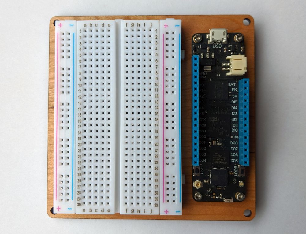 Fully assembled Meadow developer kit with breadboard and Meadow board mounted.