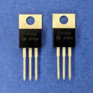 Photo of two TIP120 power transistors.