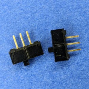 Photo of two three-pin, two-position switches.
